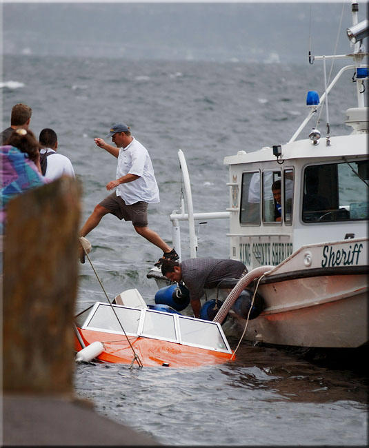 Man jumps between boats